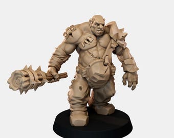 May include: A beige unpainted miniature figure of a muscular humanoid creature with a large head and broad shoulders. The figure wears armor plates on the shoulders and waist, and holds a large spiked club in its right hand.