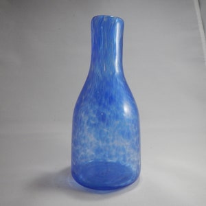 Clear and blue hand blown glass bottle