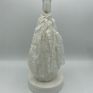 Beige decorative empty glass wine bottle