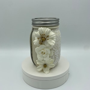 Beige mason jar with lace and flowers