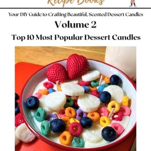 May include: The cover of "The Candle Chef Recipe Books, Volume 2" shows a bowl of dessert candles. The candles are designed to look like a bowl of cereal with strawberries, blueberries, and colourful wax pieces. The text reads "Your DIY Guide to Crafting Beautiful, Scented Dessert Candles."