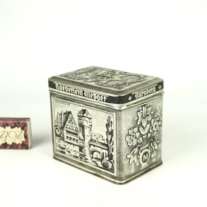 Ancienne boîte en fer blanc, boîte en relief antique, récipient en métal vintage, boîte en fer blanc vintage, boîte de conserve allemande Haeberlein-Metzger, petite boîte, boîtes à charnière