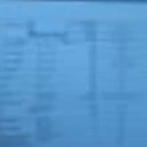 May include: A blue sheet of paper with a table of data. The table has multiple columns and rows with text. The text is small and difficult to read. The paper is slightly wrinkled.