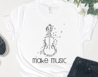 May include: White t-shirt with a black design of a violin made of musical notes. The text "make music" is printed below the violin.