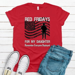 Red graphic t-shirt featuring an American flag and soldier silhouette that says  Red Fridays For My Daughter - Remember Everyone Deployed.