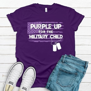Purple graphic t-shirt featuring a distressed purple American flag and dog tags that says Purple Up for the Military Child.