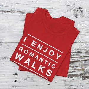 Red graphic t-shirt that says I Enjoy Romantic Walks to the Taco Truck.
