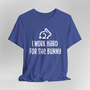 Royal blue graphic t-shirt with rabbit design that says I Work Hard For The Bunny.