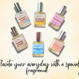 May include: Six small glass bottles of perfume with silver caps and colorful labels. The labels have names like "Bianca Latte", "Creme de Caramel", "Cloudberry", "Vanilla Crush", "Marshmallow Clouds", and "Orange Petal Marshmallow Whip". The bottles are arranged in a circle on a light yellow background. The text "Elevate your everyday with a special fragrance!" is written below the bottles. The text "Hey Sugar" is written in the bottom right corner.