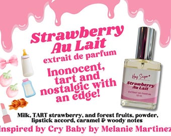 May include: A pink and white bottle of perfume labeled "Strawberry Au Lait" with the text "extrait de parfum" and "Hay Sugar" on the bottle. The bottle is surrounded by pink and white illustrations of strawberries, bows, and baby bottles. The text "Innocent, tart and nostalgic with an edge!" is written in pink letters. The text "Milk, TART strawberry, and forest fruits, powder, lipstick accord, caramel & woody notes" is written in black letters. The text "Inspired by Cry Baby by Melanie Martinez" is written in pink letters.