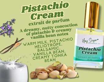 May include: A 15 ml bottle of pistachio cream perfume with a green label that says "Pistachio Cream" and "Hey Sugar Fragrance Co.". The bottle is sitting on a green background with text describing the scent notes, including warm milk, pistachio, heliotrope, balsamic, vanilla bean, and creamy tonka bean.