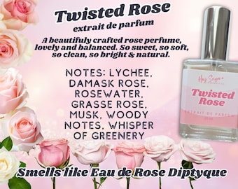 May include: A perfume bottle labeled "Twisted Rose extrait de parfum" with a pink label, surrounded by pink roses. The text describes the scent as a beautifully crafted rose perfume with notes of lychee, damask rose, and musk.