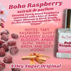 May include: A perfume bottle labeled "Boho Raspberry" with a pink label, set against a pink background. The image includes raspberries, flowers, and wood pieces. The text describes the fragrance notes.