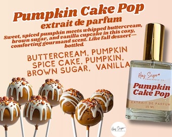 Könnte beinhalten: Ein Parfümflakon mit der Aufschrift "Pumpkin Cake Pop" mit goldenem Verschluss, neben mehreren Cake Pops. Die Cake Pops sind rund, braun und mit weißem Zuckerguss und Streuseln verziert. Die Flasche enthält 15 ml Parfüm.