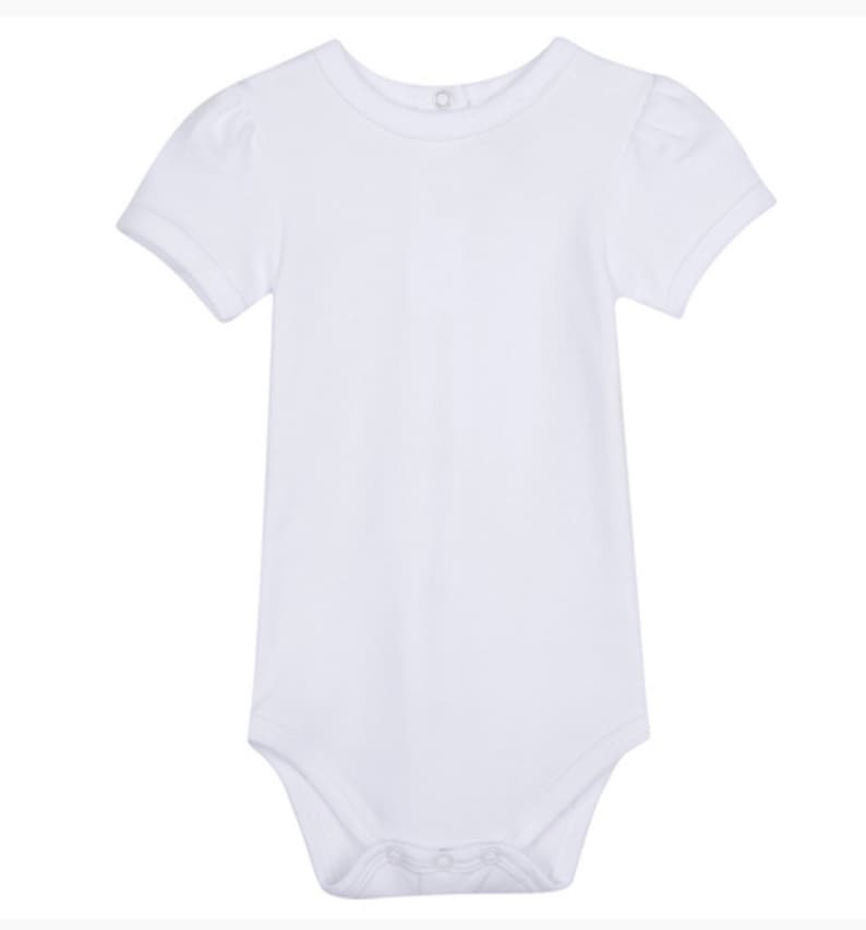 May include: A white short-sleeved bodysuit with a round neckline and puffed sleeves.