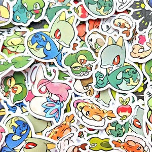 Peut inclure: Une collection d'autocollants colorés représentant diverses créatures de dessins animés. Les autocollants présentent une variété de motifs avec différentes couleurs, notamment le vert, le bleu, le rose et l'orange. Chaque autocollant a une bordure blanche.