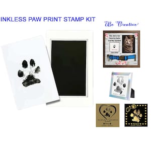 May include: Inkless paw print stamp kit with a white frame, a black ink pad, and a sample paw print. The kit also includes a small frame with a paw print and the text "You were my favorite hello and my hardest goodbye".