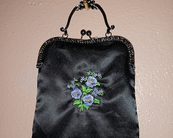 Black satin evening bag with embroidered flowers