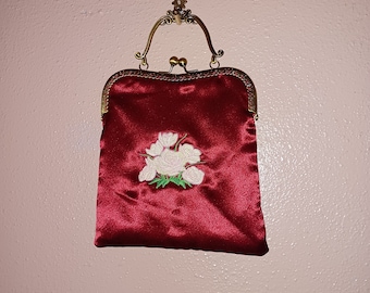 Red satin purse with embroidered roses