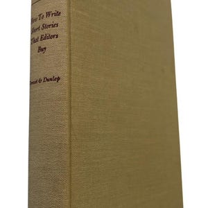 May include: A hardcover book with a tan cloth cover. The spine features dark brown text reading Earl Reed Silvers, How To Write Short Stories That Editors Buy, and Grosset & Dunlap, along with a decorative scroll pattern at the top.