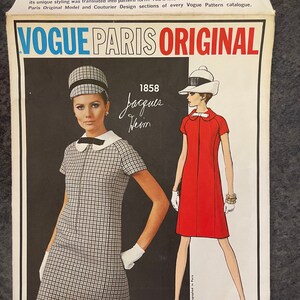 May include: Vogue Paris Original sewing pattern number 1858 for a dress designed by Jacques Heim. The pattern features two illustrations of the dress, one in black and white gingham and the other in red.