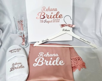Bridal party gift set. Personalised robe, a pair of slippers, champagne flute, gift box  and a white hanger.