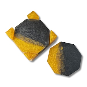 Handmade black and gold hexagon coasters with gold holder set of four