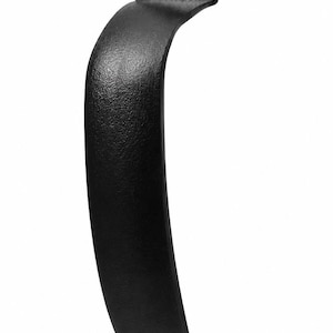 May include: A black metal door handle with a curved grip and two mounting points at the top and bottom. The handle features a textured finish and the letters JMS embossed on the upper mounting plate. Each mounting point includes a black screw.