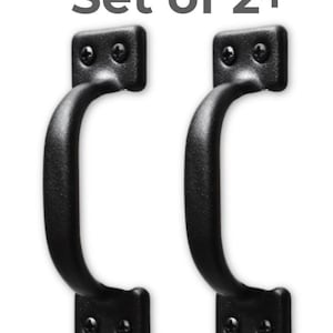 May include: Two black metal pull handles with a curved design. Each handle has a rectangular base with two screw holes and a rounded handle. The text "Set of 2+" is above the handles.