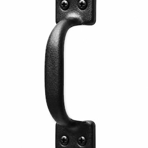 May include: A matte black metal pull handle with a textured finish. The handle features two rectangular mounting plates, each secured with two black Phillips head screws, providing a sturdy grip for doors, cabinets, or drawers in any space.