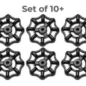 May include: A set of ten or more black valve handles. Each handle has a circular design with a central hub and radiating spokes. The text "Set of 10+" is at the top.