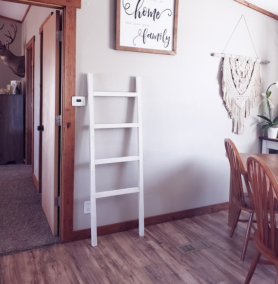 Rustic blanket ladder in a walnut stain, distressed antique white, or solid antique white.
