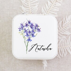 a tin with a picture of a bunch of flowers on it