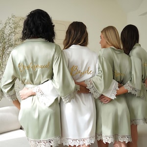 a group of women standing next to each other in robes