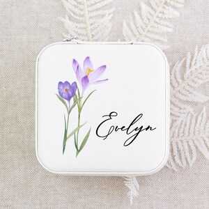 a small tin with some flowers on it