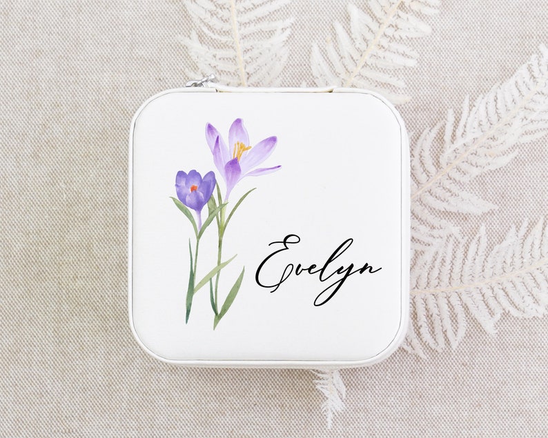 a small tin with some flowers on it