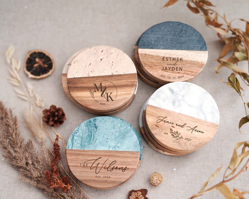 three personalized wooden coasters sitting on a table