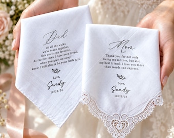 May include: Two white fabric handkerchiefs with black printed text. The left one reads Dad with a poem and the name Sandy dated 10/20/26. The right one reads Mom with a message, the name Sandy, and date 10/20/26, featuring a white lace heart border.