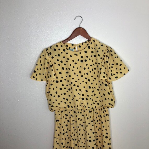 yellow and black polka dot dress