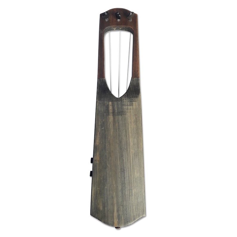 May include: A wooden lyre with four strings, a dark brown finish, and a carved wooden soundboard.