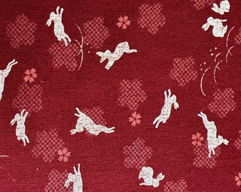 Japanese Hopping Rabbit fabric, with accent red and blue cherry blossom 100% Cotton Sheeting, Red background, 44/45", Half Yard increment