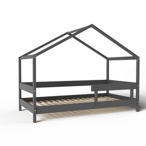 May include: A gray wooden bed frame with a house-shaped canopy. The bed has a slatted base and a small side rail.