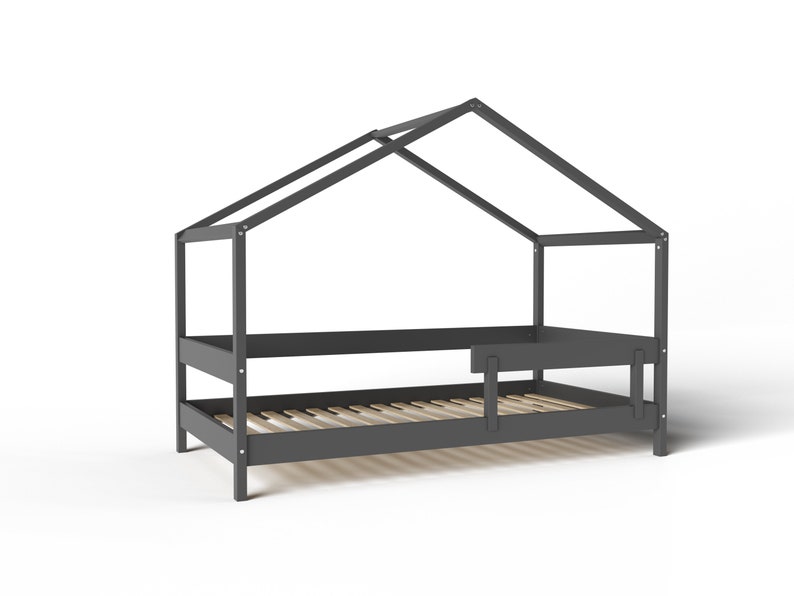 May include: A gray wooden bed frame with a house-shaped canopy. The bed has a slatted base and a small side rail.