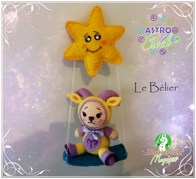 May include: A crocheted amigurumi toy of a ram or sheep in purple and yellow, sitting on a blue swing. The toy is holding a sign with the astrological symbol for Aries. A yellow star with a smiling face is hanging above the toy. The text "Le B&eacute;lier" is visible in the image.