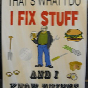 May include: A white metal sign with the text "That's what I do I fix stuff and I know things". The sign features a cartoon illustration of a man holding a beer, a wrench, and a screwdriver. There are also illustrations of a hamburger, a pair of pliers, and a loaf of bread.