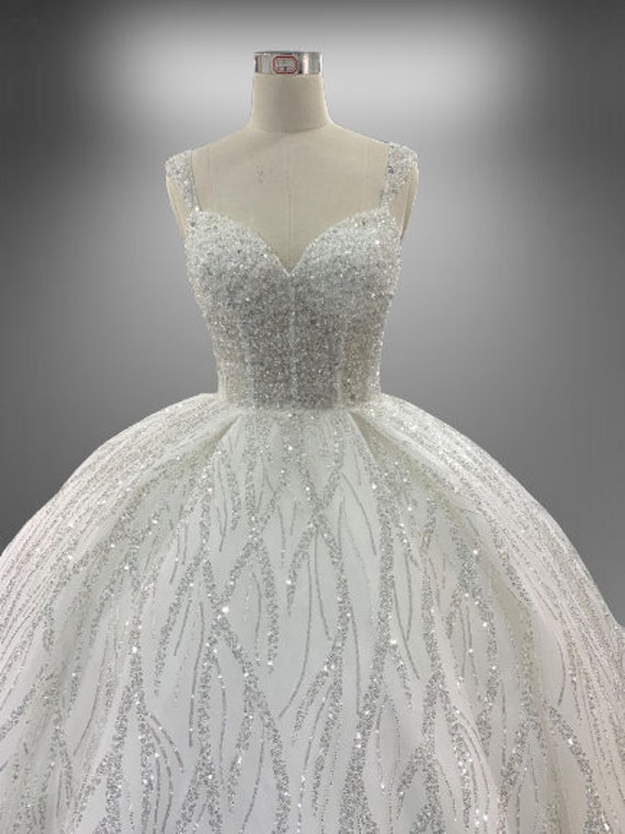 Fairy tale wedding gown with sheer corset and full skirt FJORGYN