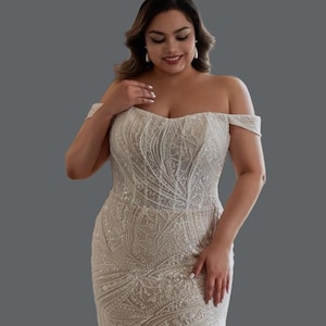 Gorgeous Beaded Mermaid Wedding Gown Available in all sizes.