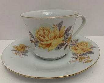 Made in China Teacup and Saucer, Yellow Flowers, Blue Green Leaves, Rose, Gold Trim,