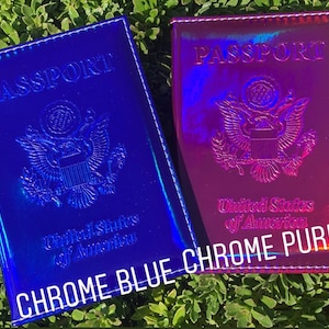 May include: Two passport holders, one blue and one purple, with a holographic finish. Both holders feature the text "PASSPORT" and the seal of the United States of America. The blue holder has the text "CHROME BLUE" and the purple holder has the text "CHROME PURPLE".