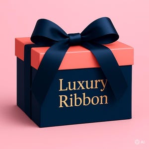 May include: A square gift box with a dark navy blue base and a coral pink lid. A large, dark navy blue satin ribbon bow sits on top. The front of the box features the gold-colored text Luxury Ribbon printed in a serif font centered on the navy surface.